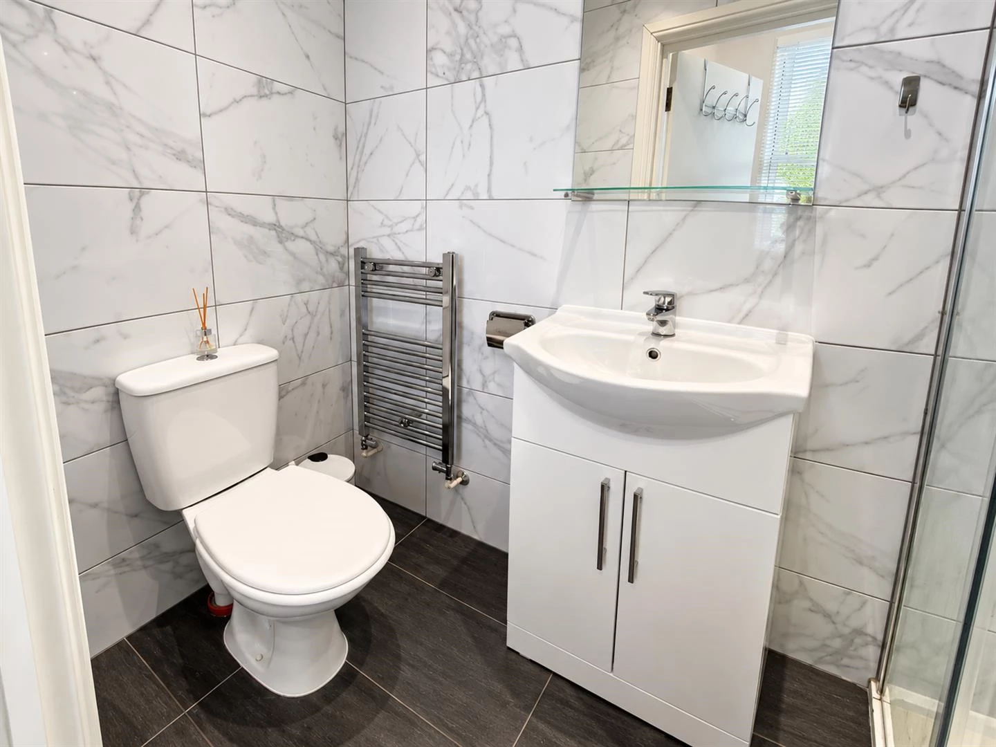 Modern Marble-Tiled Bathroom Interior.png