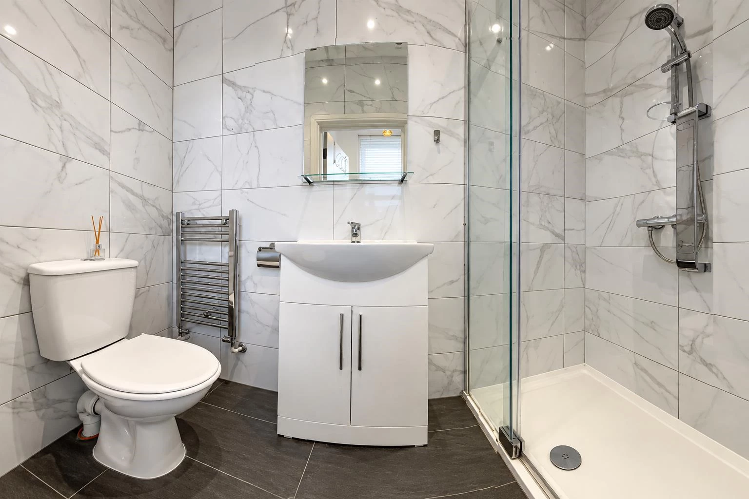 Modern Marble Bathroom with Glass Shower.png