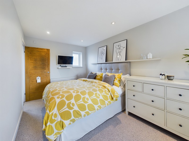 Master bedroom with dressing area and en-suite shower/wc