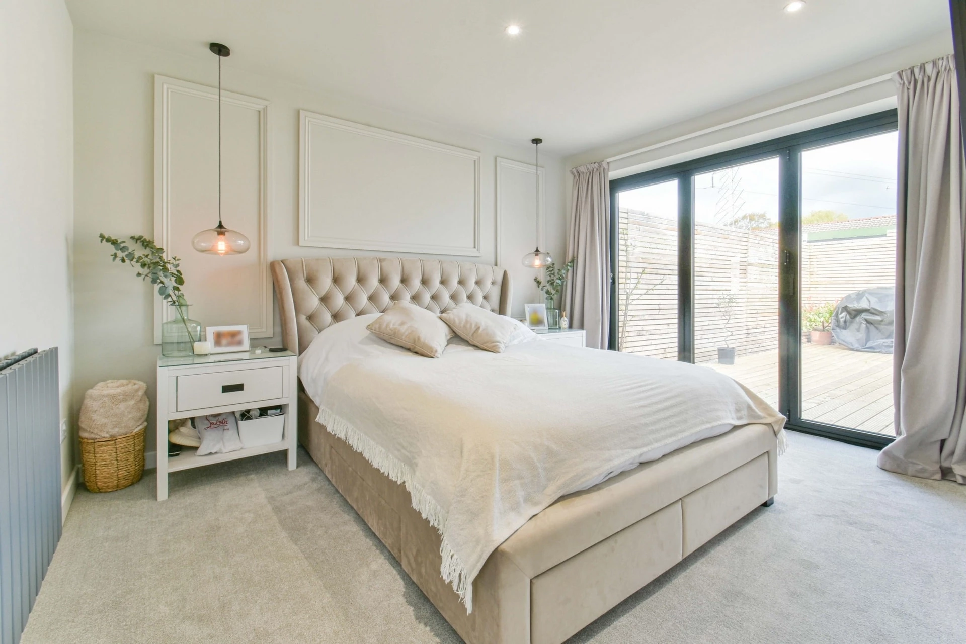 Bedroom One with neutral colour scheme and king size bed in the room. Bedroom One with neutral colour scheme and king size bed in the room.